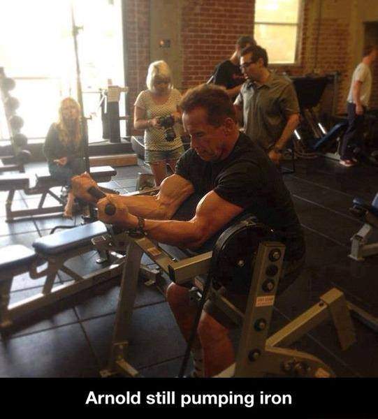 Arnold still pumping iron