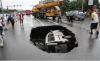 The hole in the middle of the road!